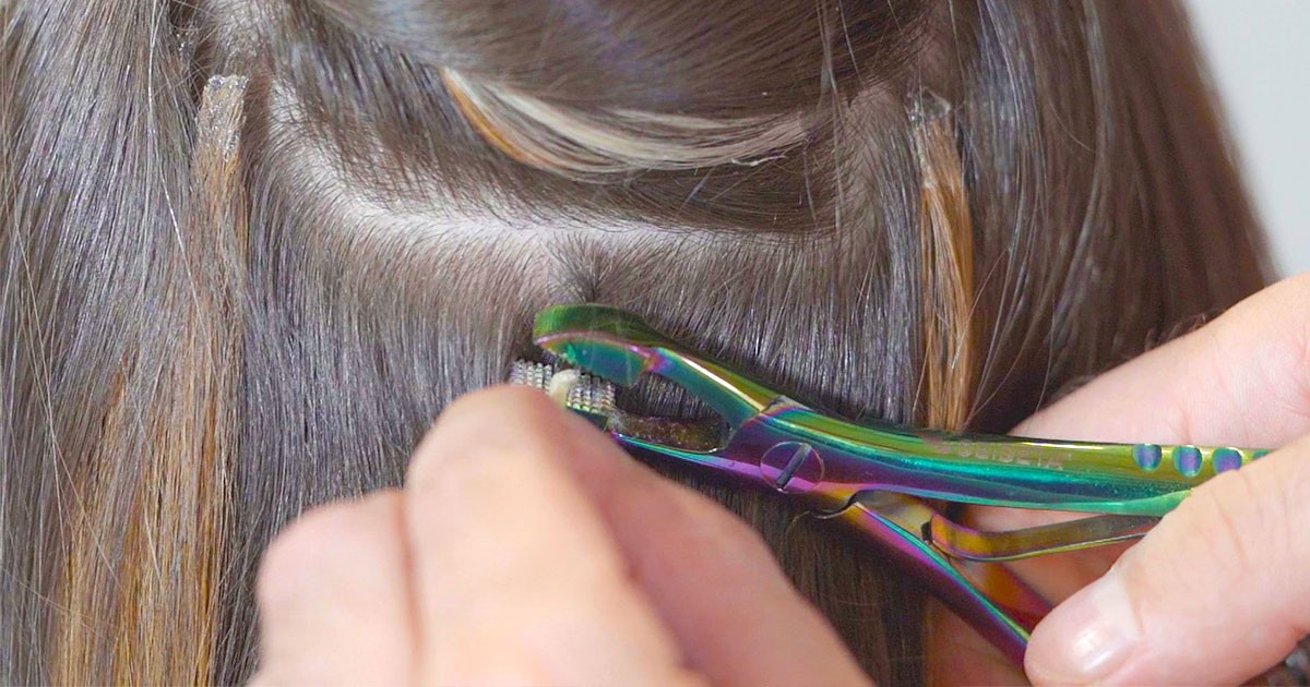 Applying keratin bond remover to extensions
